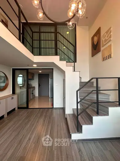 Modern duplex apartment with stylish staircase and open layout
