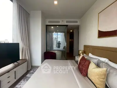 Luxurious bedroom with modern decor and city view, featuring a cozy bed and elegant furnishings.