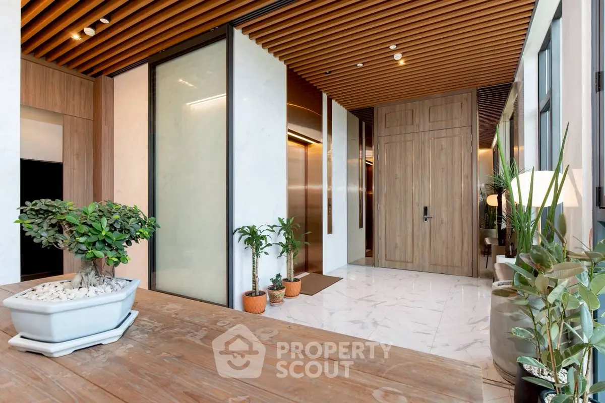 Luxurious modern building entrance with elegant wooden accents and stylish decor