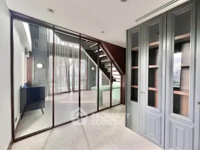 Modern duplex interior with stylish staircase and elegant cabinetry