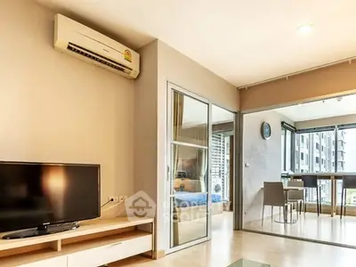 Modern apartment living room with air conditioning and open layout to dining area.
