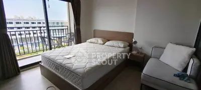 Modern bedroom with balcony view in stylish apartment