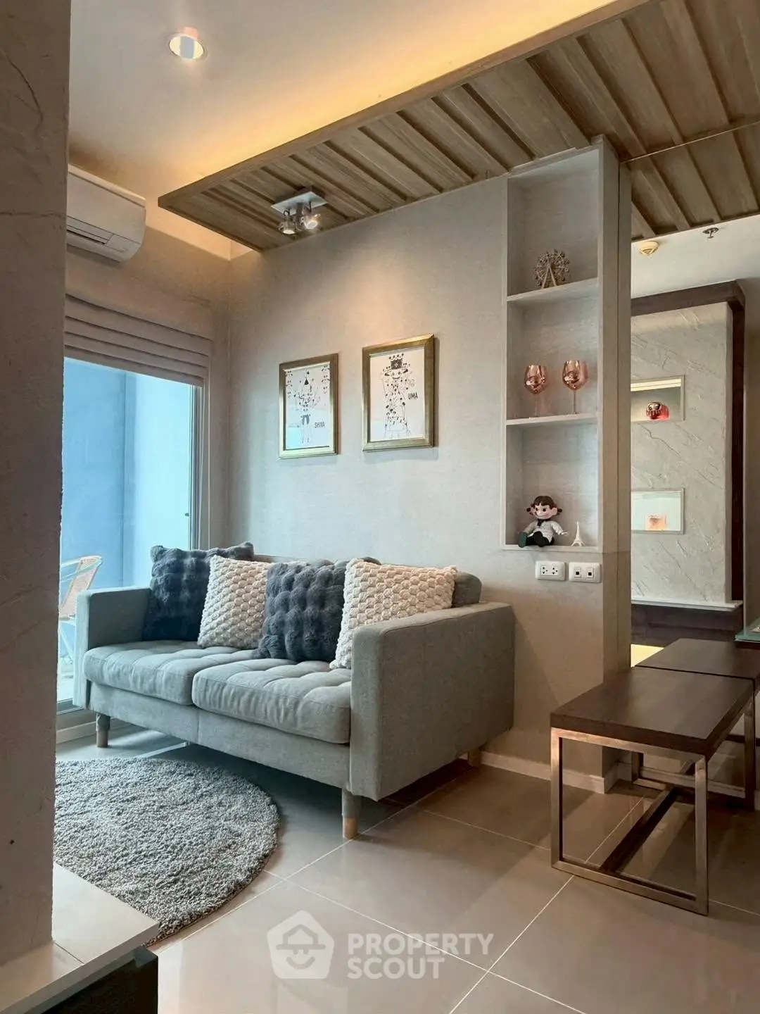 Modern living room with cozy sofa and stylish decor in a contemporary apartment.