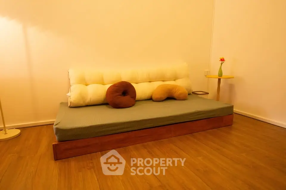 Cozy minimalist living room with wooden flooring and modern sofa