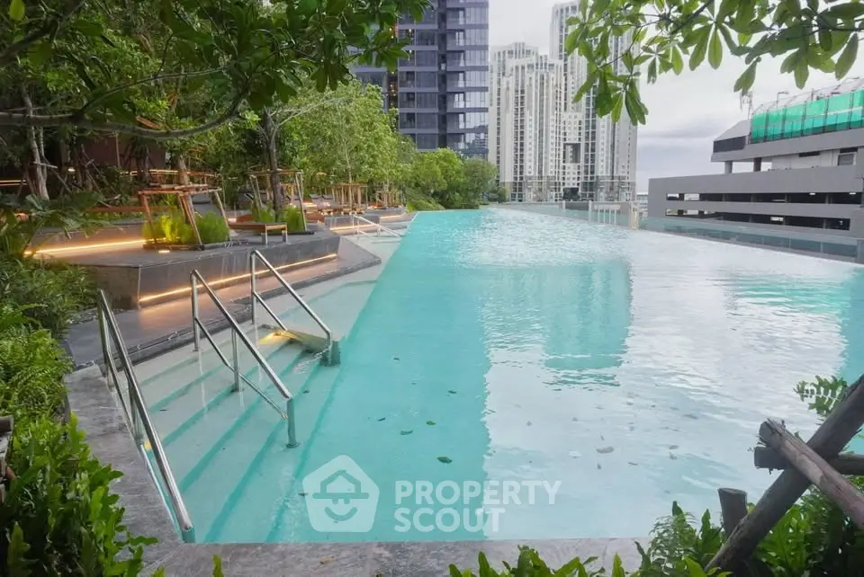 Luxurious rooftop infinity pool with stunning cityscape views and lush greenery, perfect for relaxation and leisure.