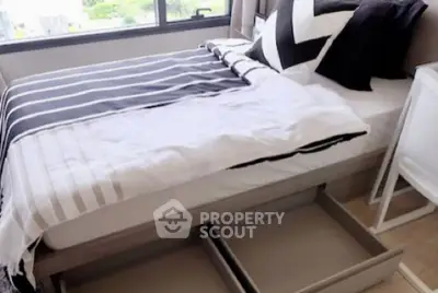 Modern bedroom with stylish bedding and under-bed storage drawers