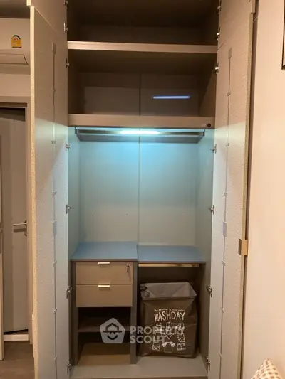 Spacious modern wardrobe with built-in lighting and storage solutions