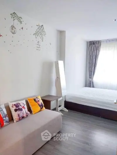 Modern studio apartment with cozy bed and stylish decor