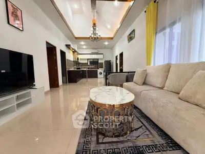 Spacious modern living room with elegant decor and open kitchen layout