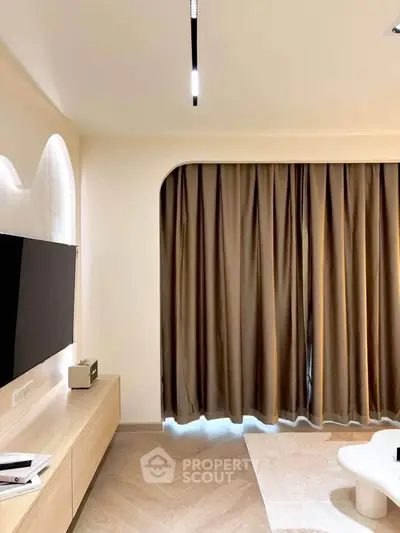 Modern living room with elegant curtains and sleek TV setup