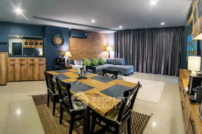 Spacious modern living room with stylish dining area and cozy seating, perfect for entertaining.