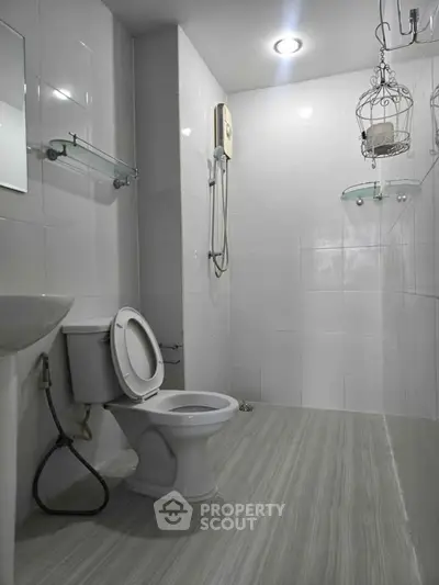 Modern bathroom with sleek design and shower area in a contemporary home.