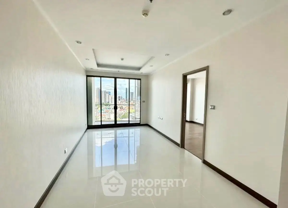 Spacious empty living room with city view and large windows