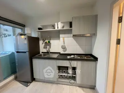 Modern kitchen with sleek cabinetry and stainless steel appliances
