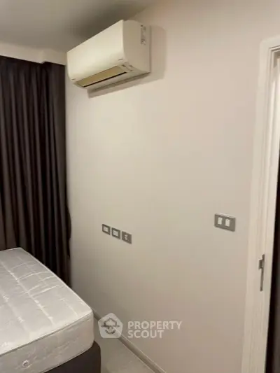 Modern bedroom with air conditioning and minimalist design