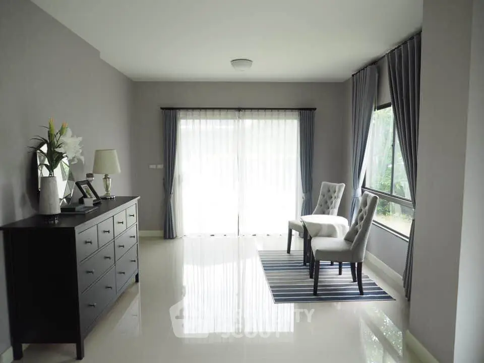 Elegant living room with large windows and stylish furniture