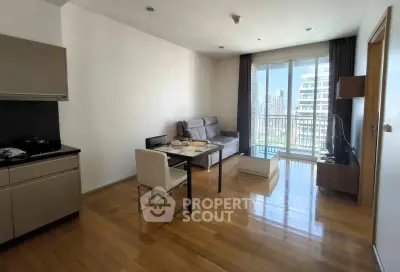 Modern living room with sleek kitchen and city view balcony in urban apartment