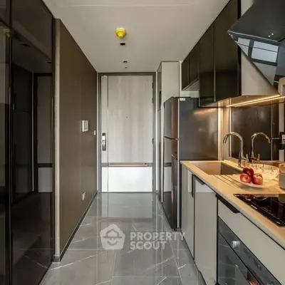 Modern kitchen with sleek design, featuring stainless steel appliances and elegant cabinetry.
