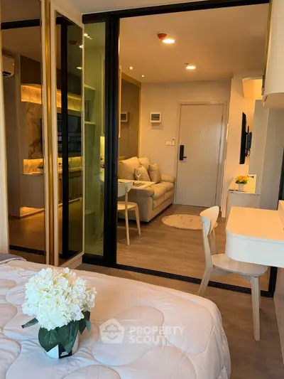 Modern studio apartment with cozy living area and stylish decor