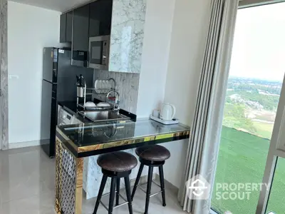 Sleek modern kitchen with marble countertops, stainless steel appliances, and a breathtaking view from the high-rise apartment.