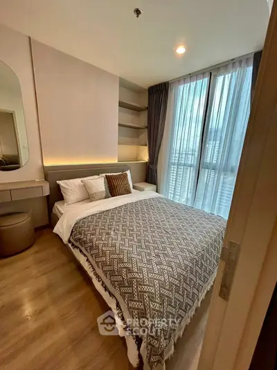 Modern bedroom with stylish decor and large window view