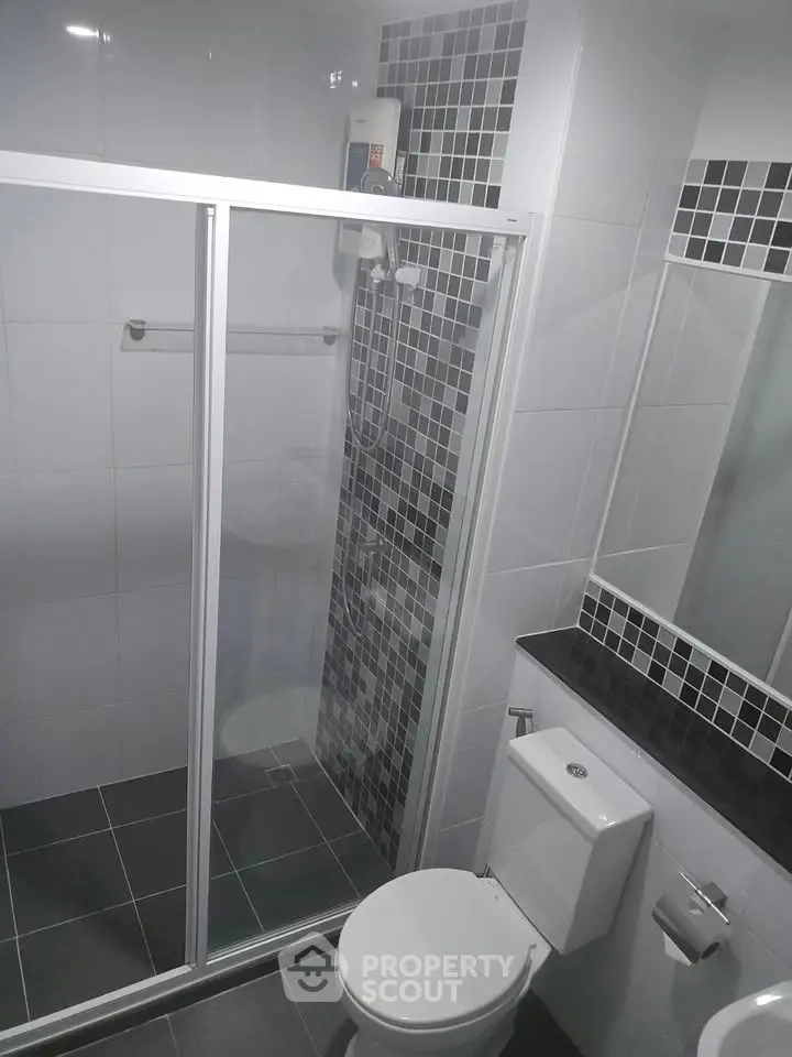Modern bathroom with sleek shower enclosure and stylish tile design