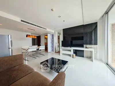 Spacious modern living room with sleek furniture and open dining area