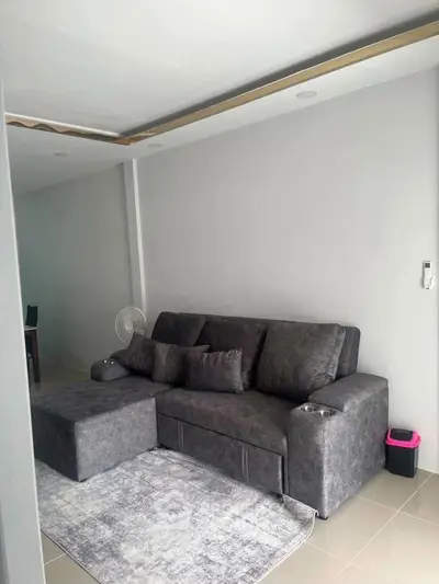 Modern living room with stylish gray sofa and sleek decor