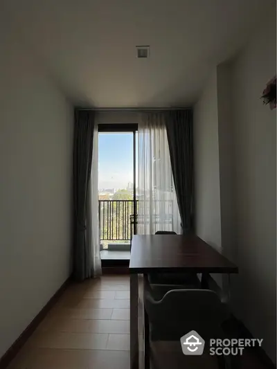 Bright study room with balcony view and modern furniture