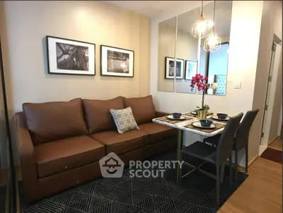 Stylish living room with brown leather sofa and elegant dining setup