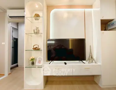 Modern living room with sleek TV unit and elegant decor