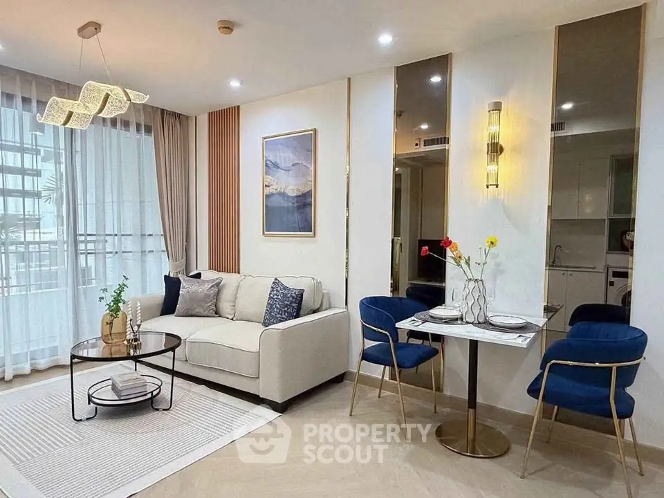 Modern living room with elegant decor, cozy seating, and stylish dining area in a contemporary apartment.