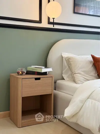 Modern bedroom with stylish nightstand and cozy bed setup