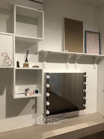Stylish modern study area with shelves and illuminated mirror