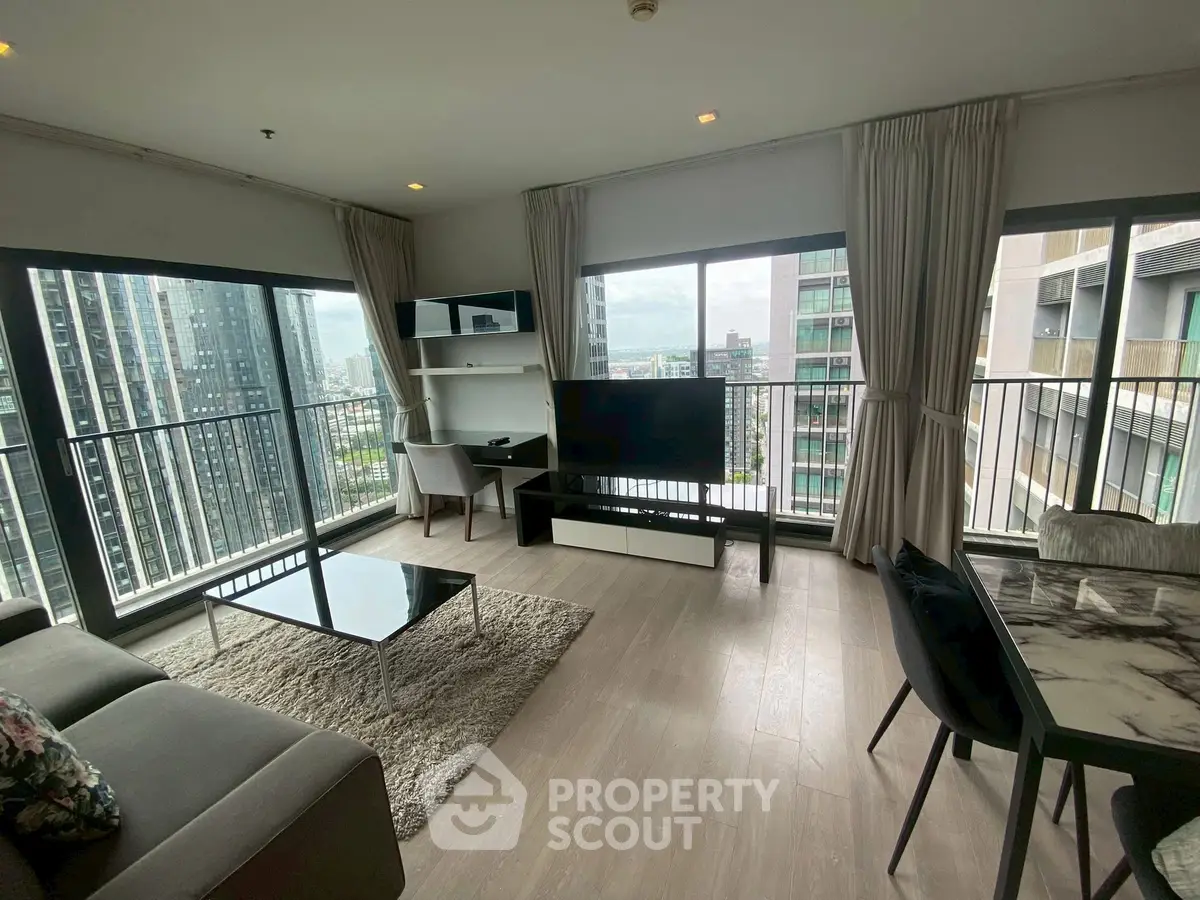 Spacious modern living room with large windows and city view