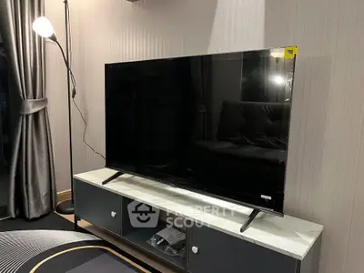 Modern living room with sleek TV and stylish decor