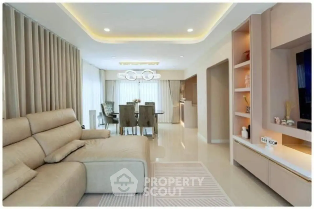 Luxurious modern living room with elegant beige sofa and stylish dining area