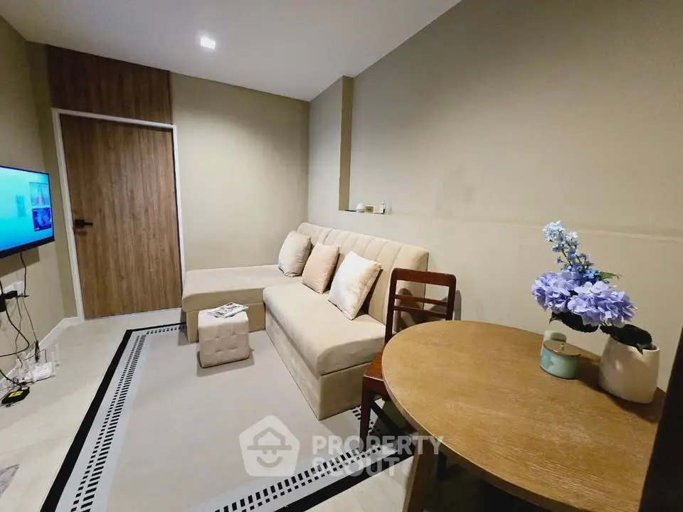 Cozy living room with modern decor and comfortable seating, perfect for relaxation and entertainment.