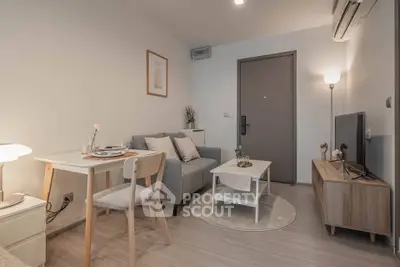 Cozy modern living room with stylish furniture and ambient lighting, perfect for relaxation and entertainment.