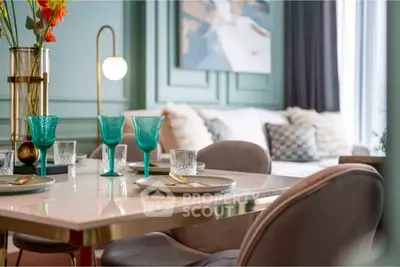 Elegant dining area with modern decor and stylish table setting in a luxurious apartment.
