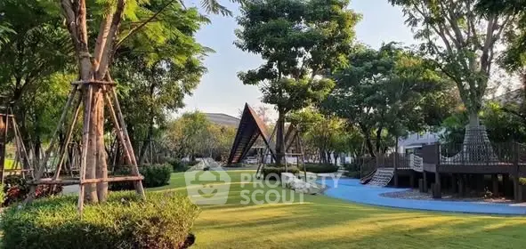 Beautiful garden with lush greenery and modern playground in a serene residential area.