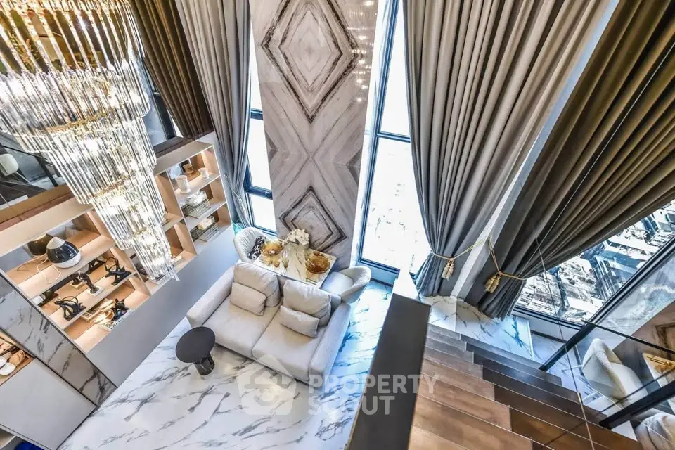 Luxurious high-rise living room with floor-to-ceiling windows and elegant chandelier