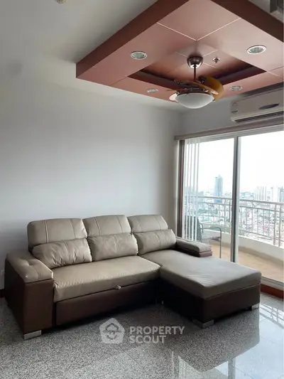 Spacious living room with modern sofa and city view balcony