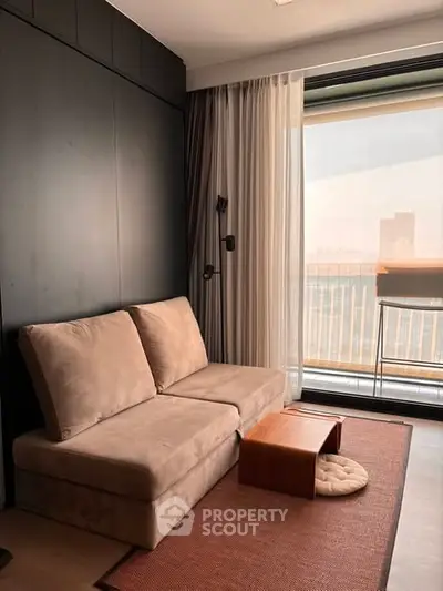 Modern living room with cozy sofa and large window offering city view