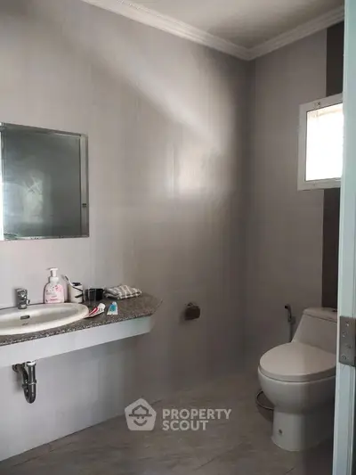 Modern bathroom with sleek design and essential fixtures