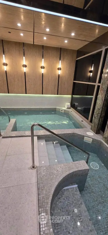 Luxurious indoor pool area with modern lighting and elegant design