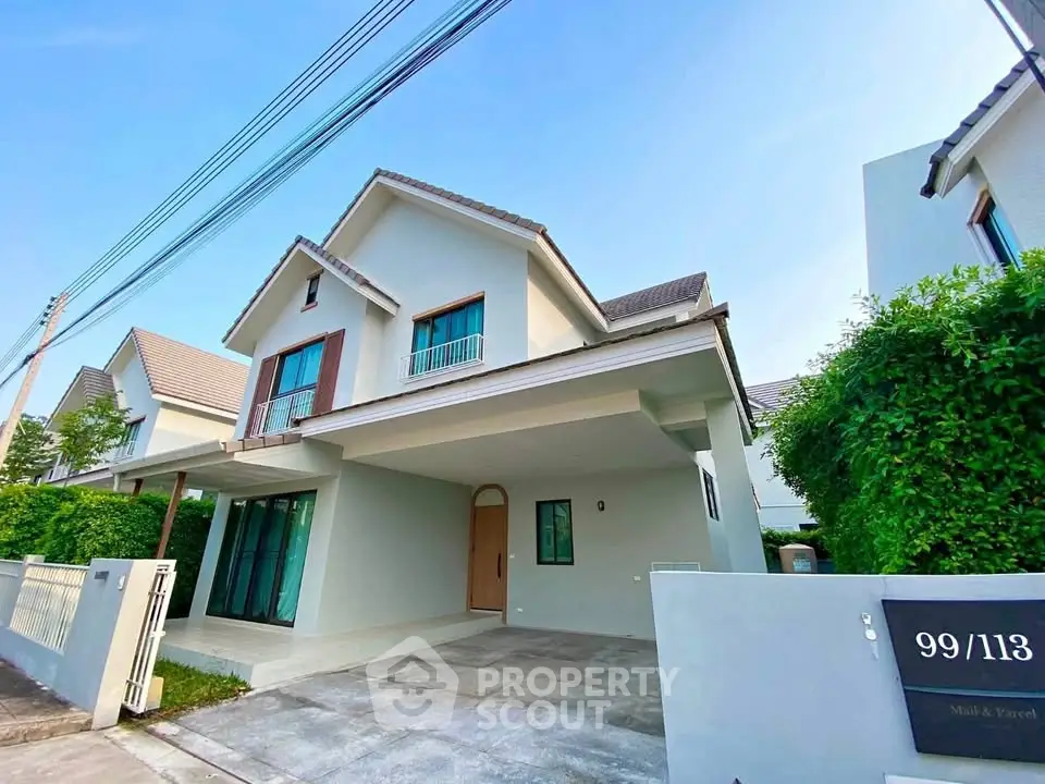 Charming modern house with spacious driveway and lush greenery, perfect for family living.