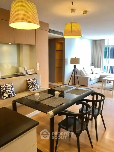 Modern open-plan living room with stylish dining area and cozy seating.