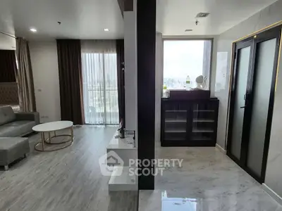 Spacious modern living room with elegant decor and large windows