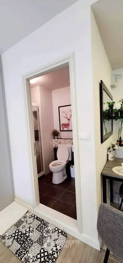 Modern bathroom with stylish decor and elegant fixtures in a contemporary apartment.